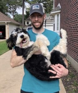 man holding bordoodle