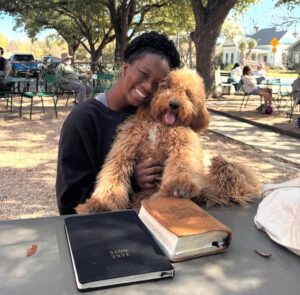 woman and goldendoodle